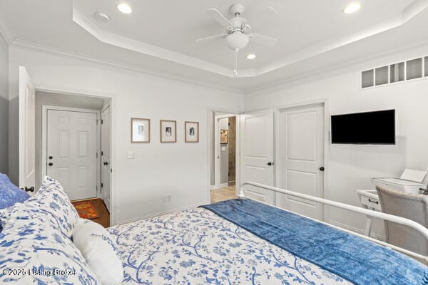 bedroom with recessed lighting, a raised ceiling, visible vents, and crown molding