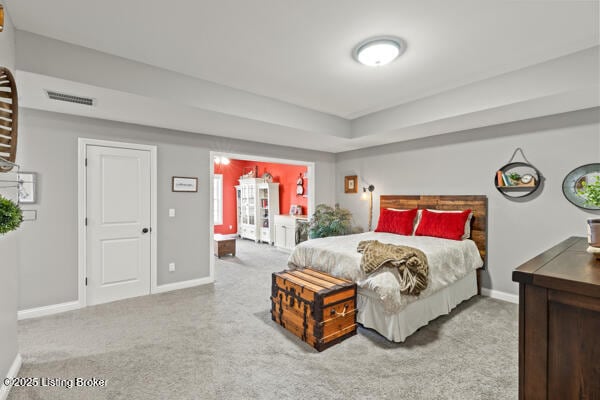 bedroom featuring baseboards, visible vents, and carpet flooring