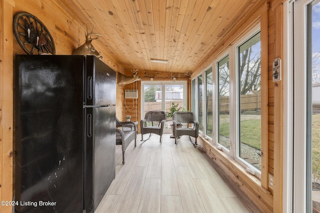 sunroom / solarium with a wall unit AC and wood ceiling