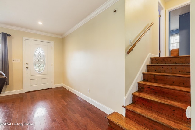 entryway with recessed lighting, dark wood-type flooring, baseboards, stairs, and crown molding