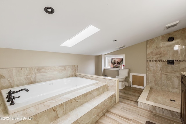 bathroom with a walk in shower, toilet, visible vents, a bath, and lofted ceiling with skylight