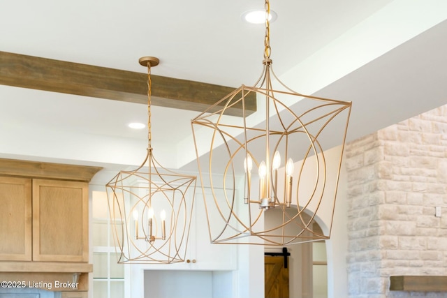 details featuring a notable chandelier, recessed lighting, light brown cabinets, and pendant lighting