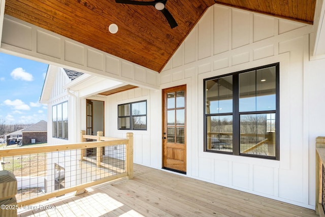 wooden terrace featuring a ceiling fan