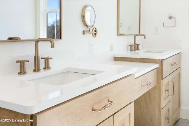 full bathroom with double vanity and a sink