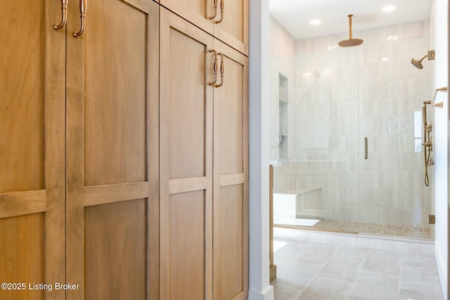 bathroom with recessed lighting and a stall shower