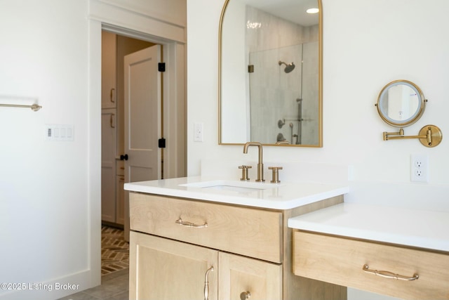 bathroom featuring vanity and a shower stall