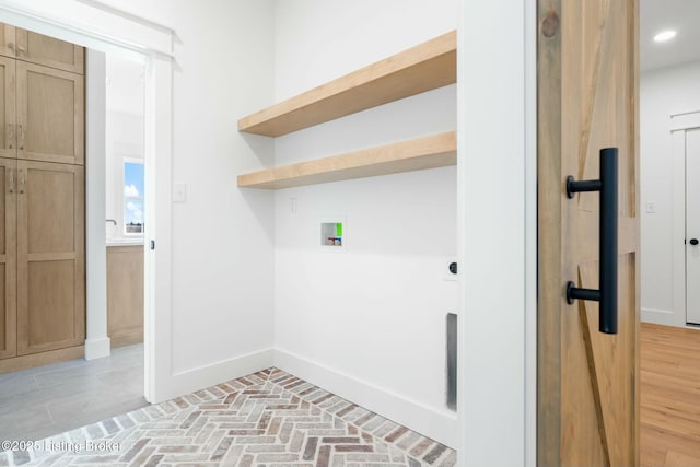 laundry room featuring washer hookup, recessed lighting, brick floor, baseboards, and laundry area