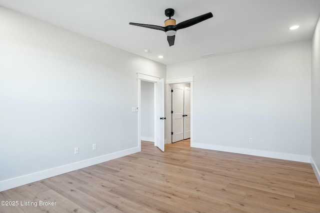 unfurnished bedroom with recessed lighting, light wood-type flooring, and baseboards