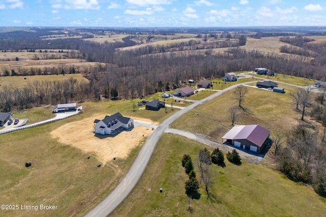 birds eye view of property with a rural view