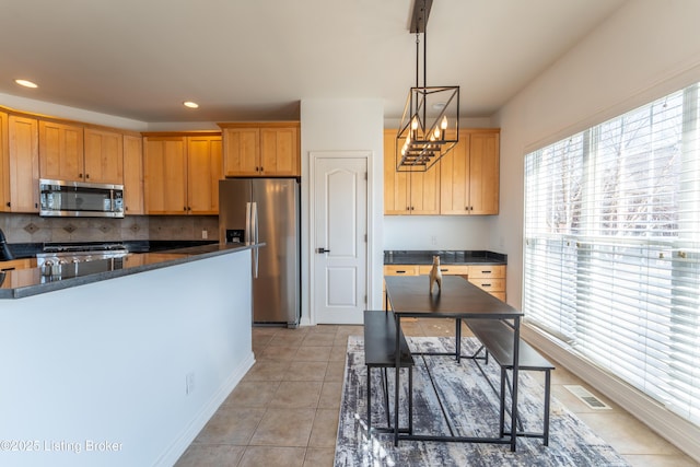 kitchen featuring light tile patterned floors, recessed lighting, visible vents, appliances with stainless steel finishes, and backsplash