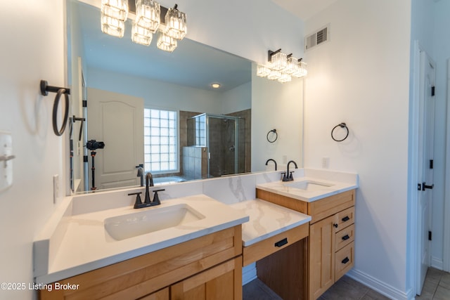 full bath featuring a stall shower, vanity, visible vents, and tile patterned floors