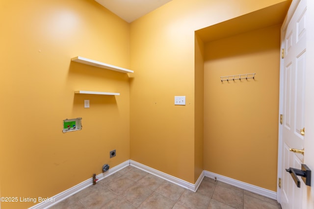 laundry area with washer hookup, gas dryer hookup, laundry area, baseboards, and tile patterned floors