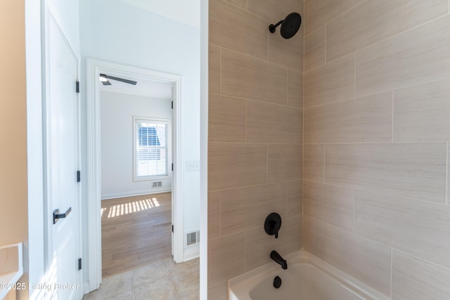 full bathroom featuring tub / shower combination, tile patterned flooring, visible vents, and baseboards