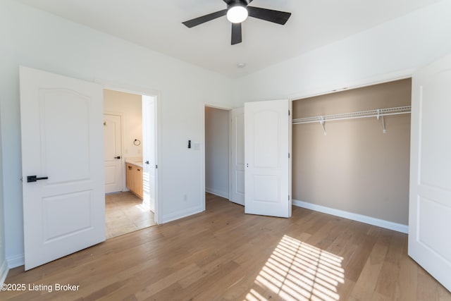 unfurnished bedroom with ceiling fan, light wood finished floors, a closet, and baseboards