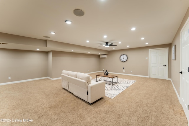 living area with recessed lighting, light colored carpet, a ceiling fan, baseboards, and a wall mounted air conditioner