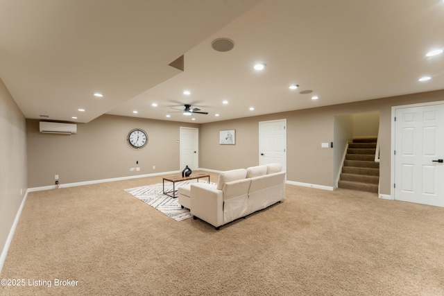 living area with light carpet, a wall mounted air conditioner, stairs, and recessed lighting