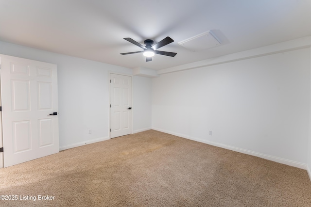 empty room with carpet, ceiling fan, and baseboards