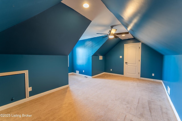 bonus room featuring a ceiling fan, carpet flooring, vaulted ceiling, and baseboards