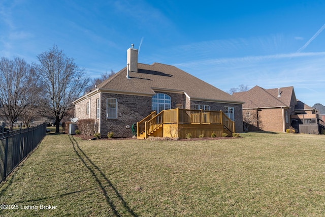 back of house with a lawn, stairway, fence, a deck, and brick siding