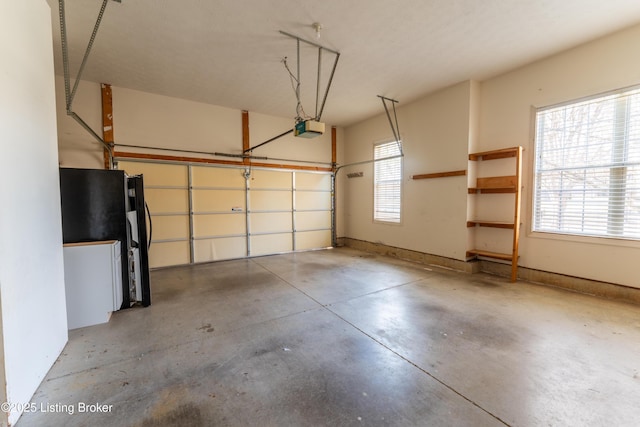 garage featuring baseboards and a garage door opener