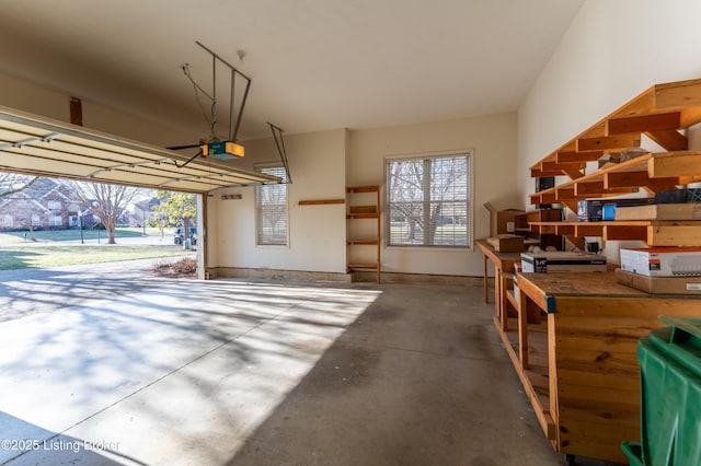 garage featuring baseboards and a garage door opener