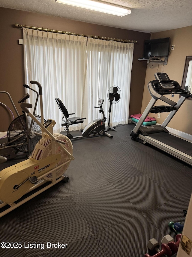 exercise area with a textured ceiling