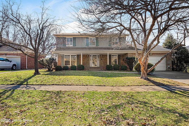 traditional-style home featuring a garage, concrete driveway, a front lawn, and brick siding