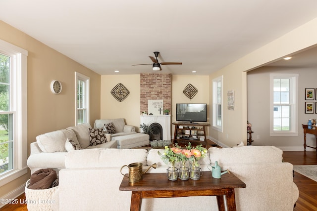 living area with a wealth of natural light and baseboards