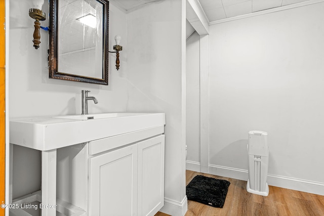 4805 Clarmar Rd, Louisville, KY 40299 - bathroom featuring vanity, wood finished floors, and baseboards
