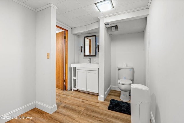 4805 Clarmar Rd, Louisville, KY 40299 - bathroom with baseboards, toilet, wood finished floors, and vanity