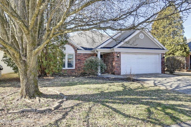 ranch-style house with driveway, roof with shingles, an attached garage, a front lawn, and brick siding