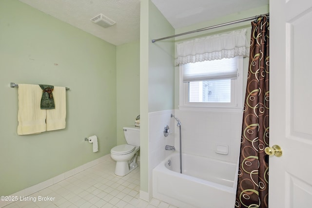 bathroom featuring visible vents, toilet, a textured ceiling, tile patterned flooring, and baseboards