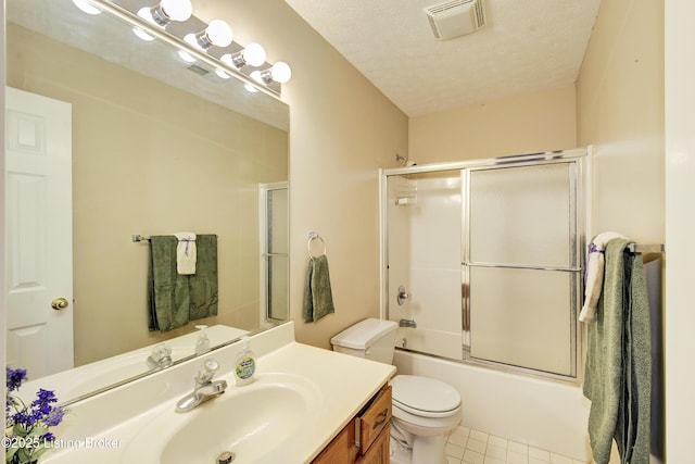 full bath with visible vents, toilet, tile patterned flooring, a textured ceiling, and vanity