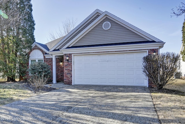 ranch-style home featuring concrete driveway and brick siding