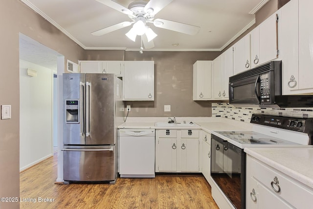 kitchen featuring black microwave, white dishwasher, ornamental molding, stainless steel fridge with ice dispenser, and electric range oven