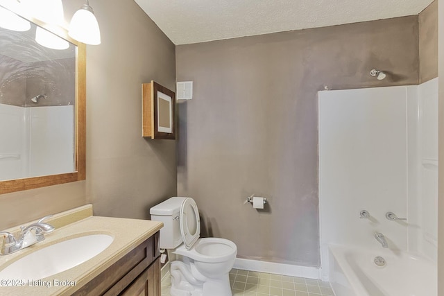 full bath featuring a textured ceiling, toilet, vanity, baseboards, and  shower combination