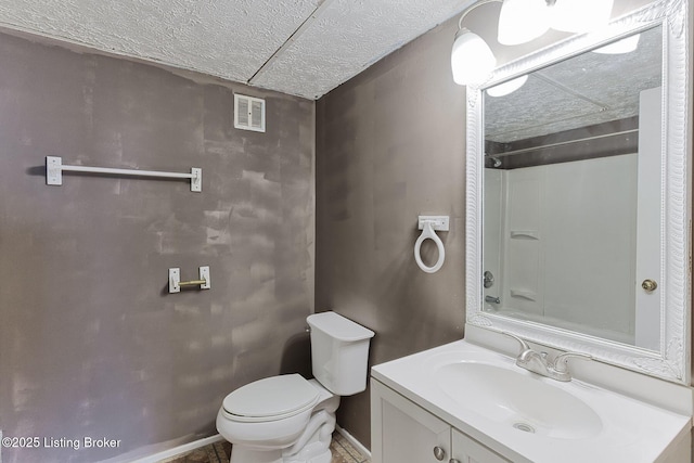 full bath featuring toilet, visible vents, a textured ceiling, and vanity