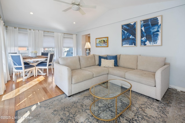 living room with lofted ceiling, ceiling fan, hardwood / wood-style flooring, and recessed lighting