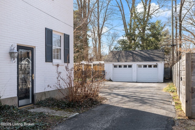 detached garage with fence