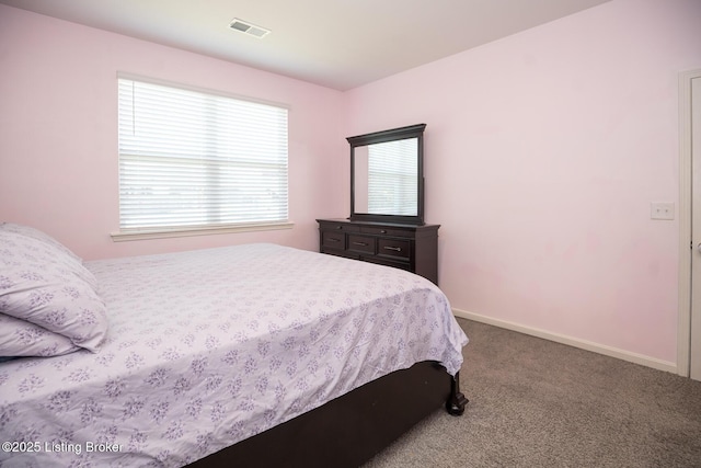 bedroom featuring carpet floors, baseboards, and visible vents
