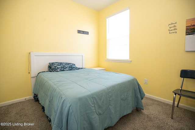 carpeted bedroom with baseboards