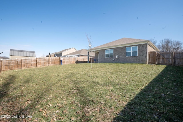 view of yard with a fenced backyard