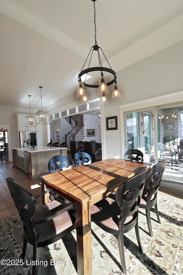 dining space with dark wood-style floors and stairway