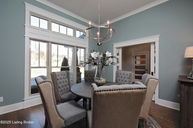 dining space with crown molding, a notable chandelier, baseboards, and dark wood-style flooring