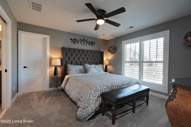 bedroom with baseboards, visible vents, carpet floors, and ceiling fan