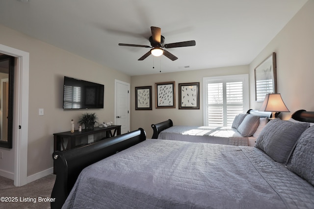 carpeted bedroom featuring visible vents, a ceiling fan, and baseboards