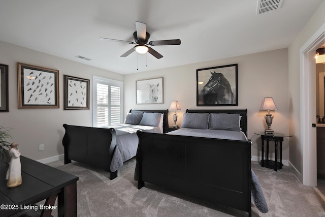 carpeted bedroom with visible vents, baseboards, and ceiling fan