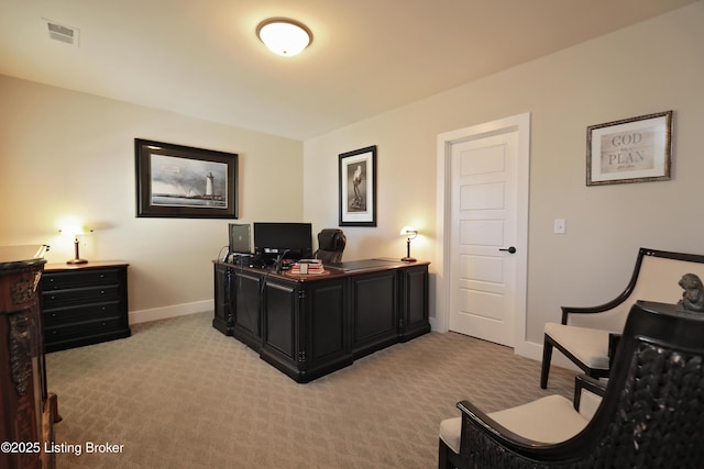 home office featuring baseboards, visible vents, and light carpet