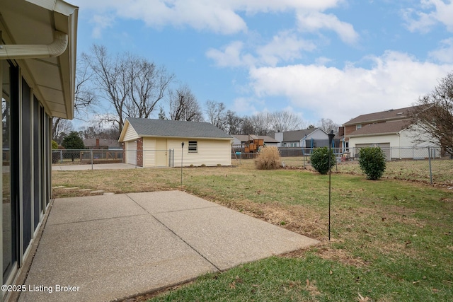 view of yard with a fenced backyard, a detached garage, a patio, and an outdoor structure