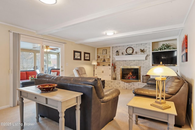 living room featuring built in shelves, a brick fireplace, beam ceiling, and light colored carpet